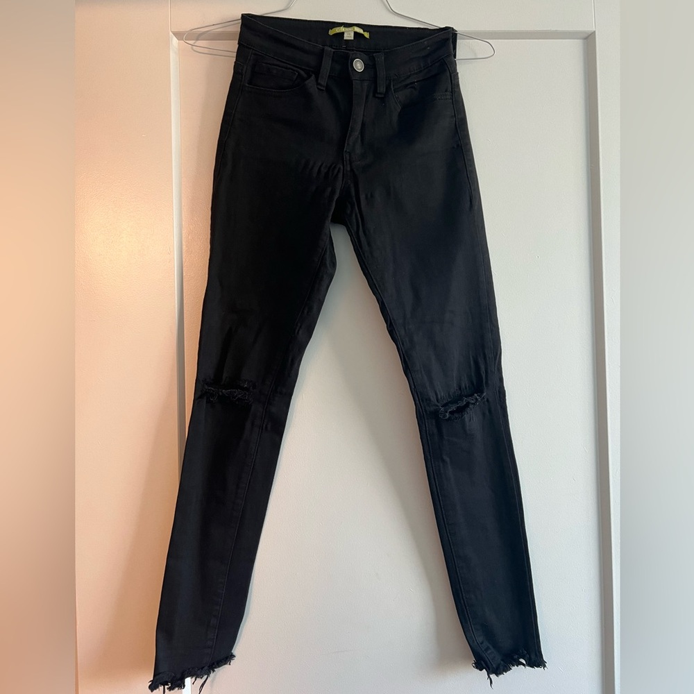 Black distressed skinny jeans.